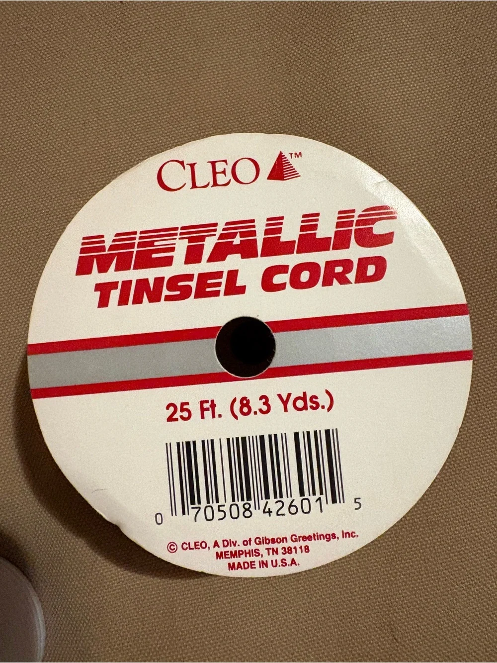 Metallic Tinsel Cord Spool and an Assortment of Ribbons. No Full Spools.